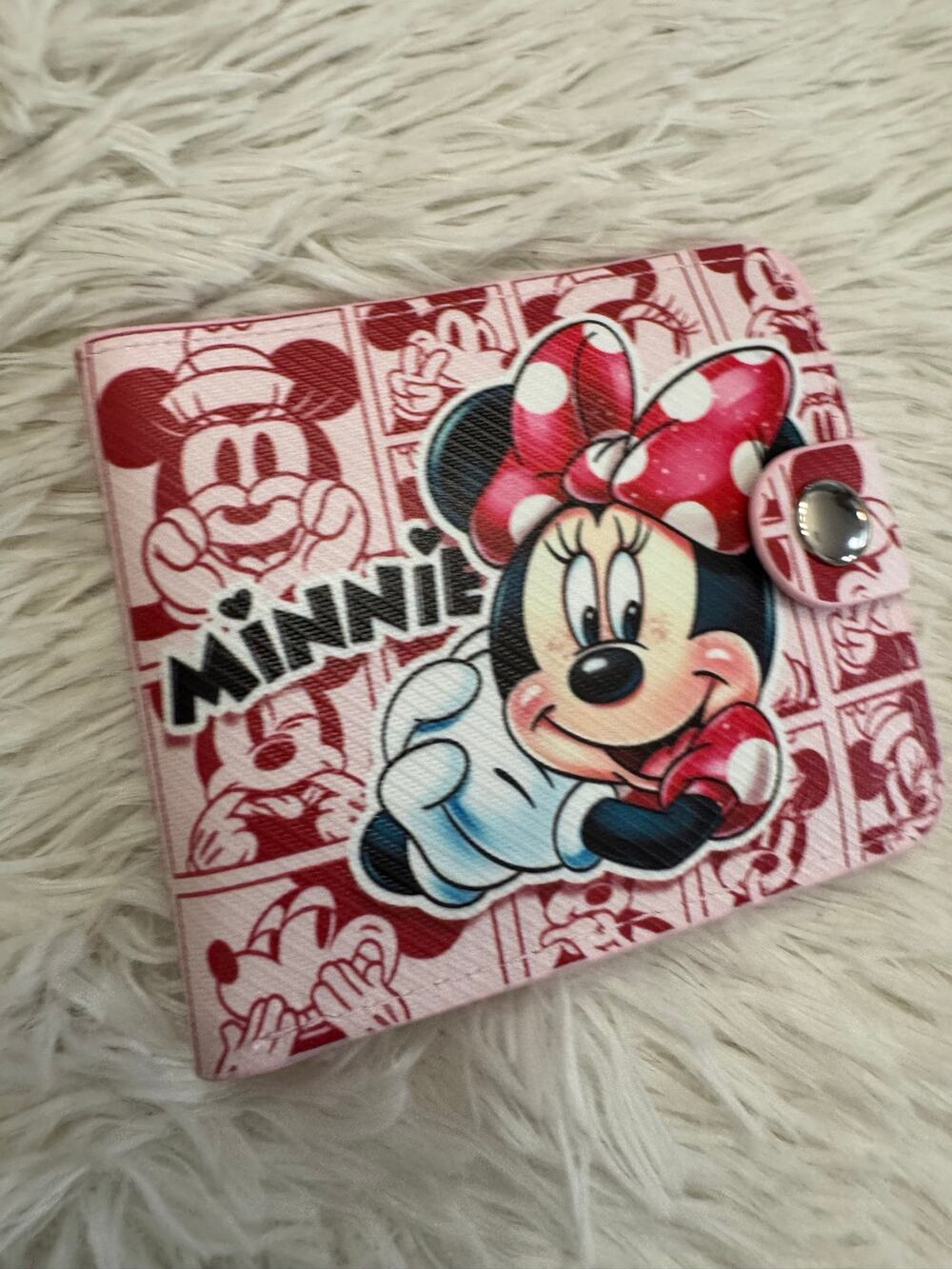Minnie Mouse wallet with red polka dot bow and repeating Minnie Mouse graphics